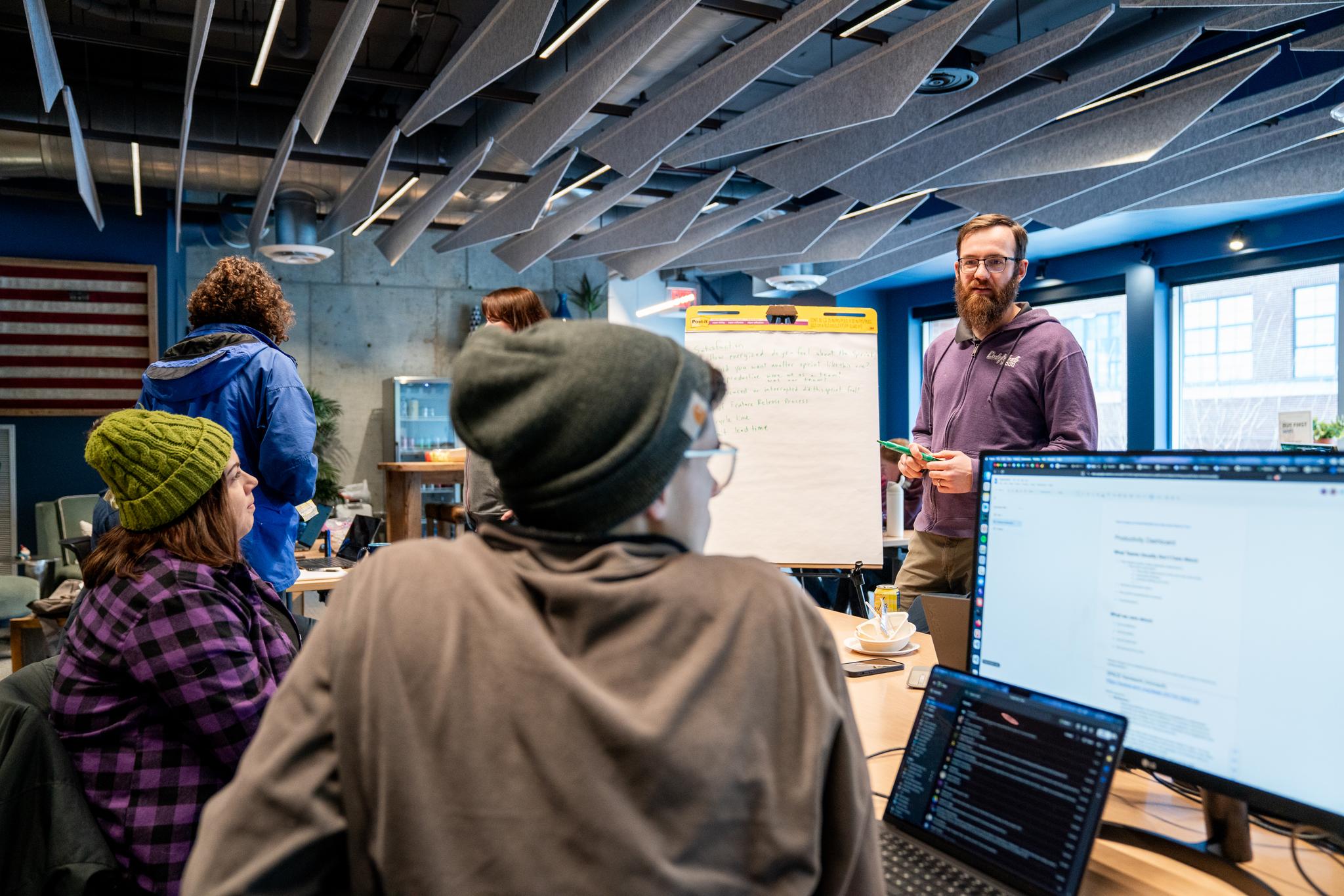Developers working at MoreSteam's Annual Hackathon 2026