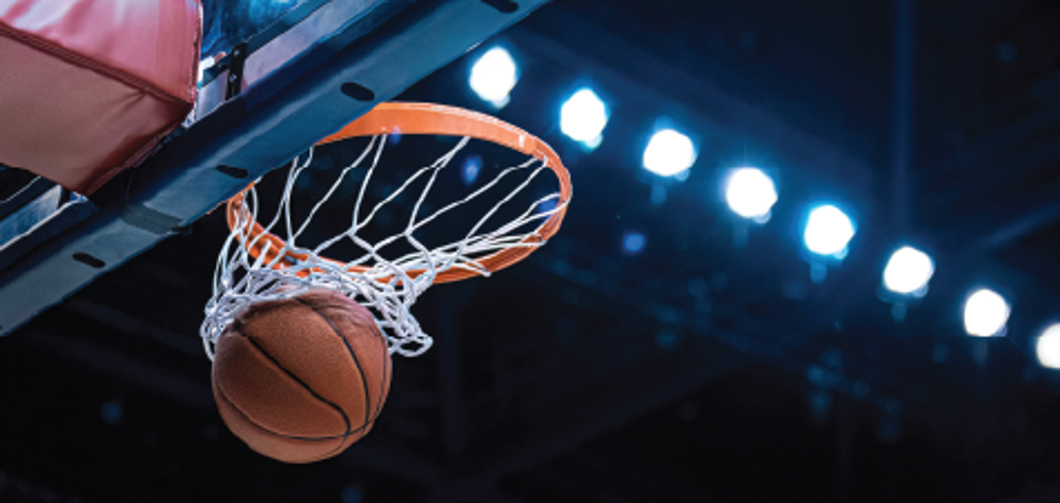 Basketball swishing through a basketball hoop
